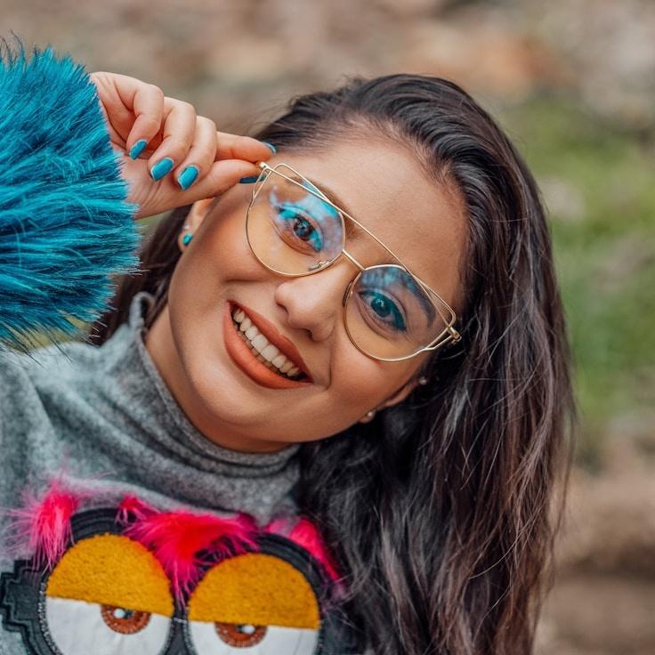 Asha Mehta, Lead Design Curator at Balanced Source True, reviewing corporate floral arrangements